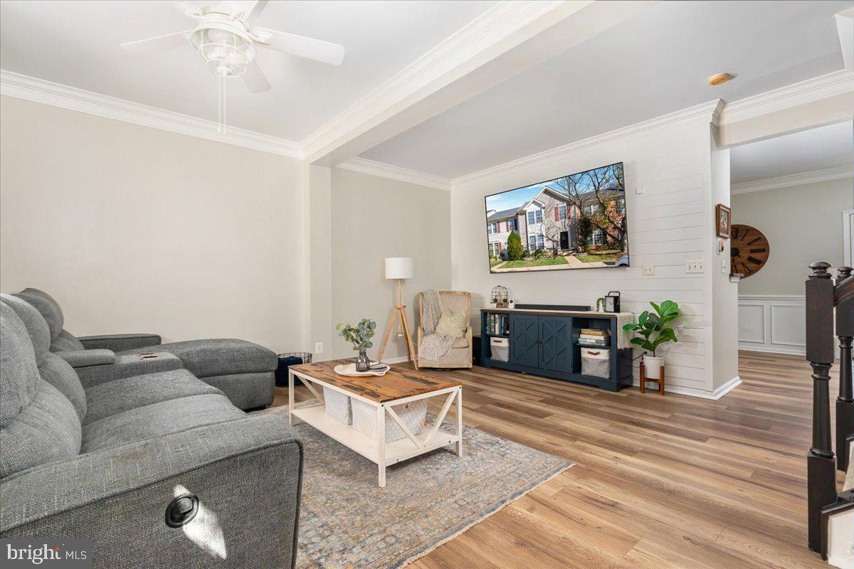 7235 Traphill Way Gainesville, VA 20155 - Photo 6 of 40 a living room with furniture and a flat screen tv