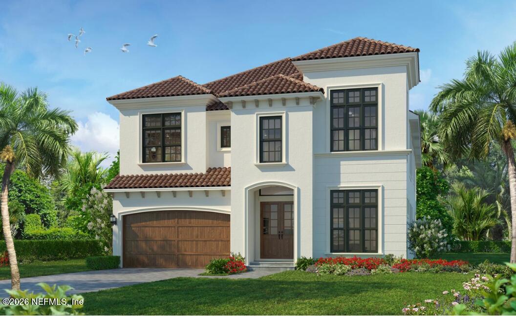 a front view of a house with a yard and garage