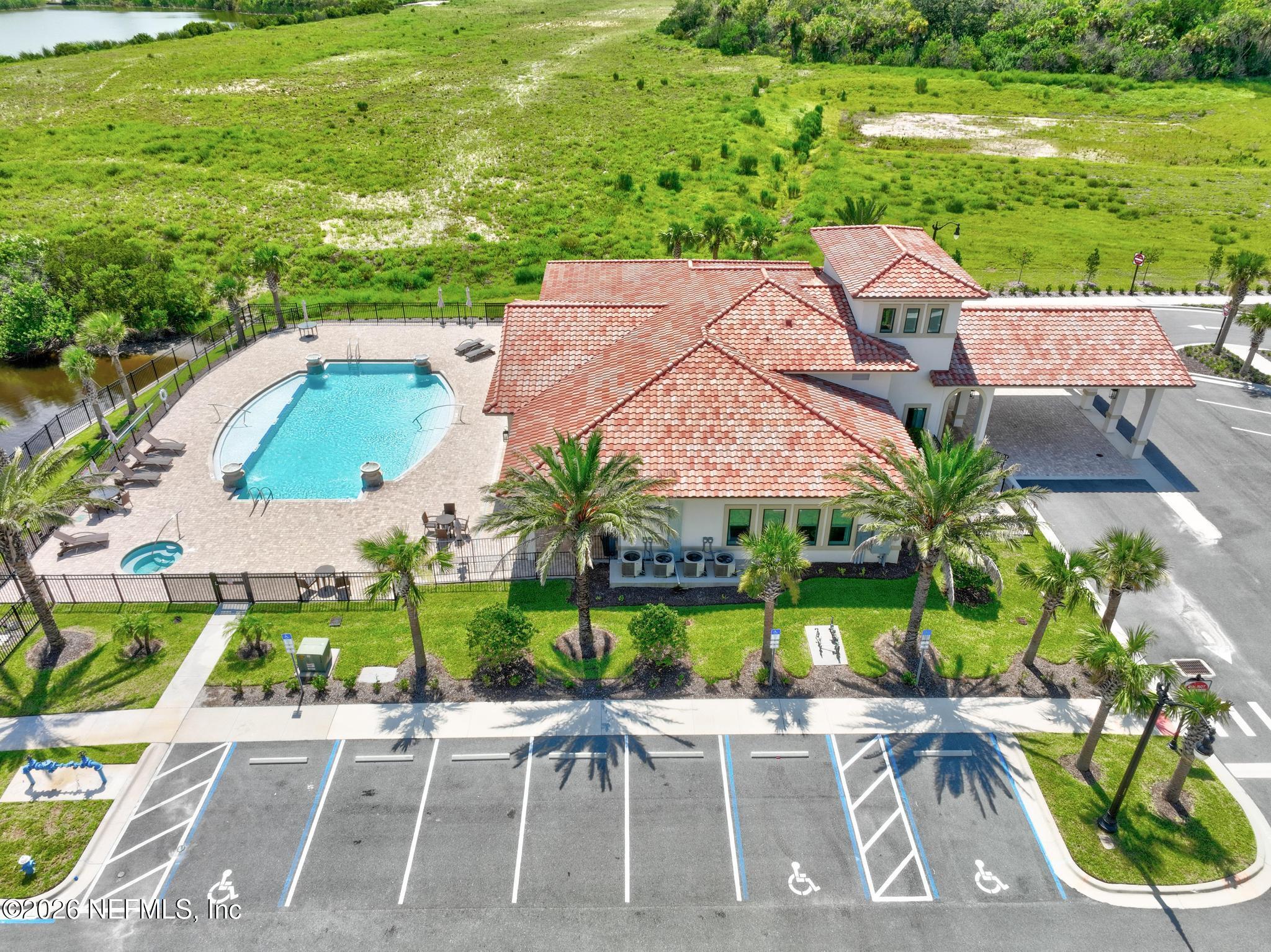 2 Menorca Way Palm Coast, FL 32137 - Photo 12 of 37 an aerial view of a house with a garden and lake view
