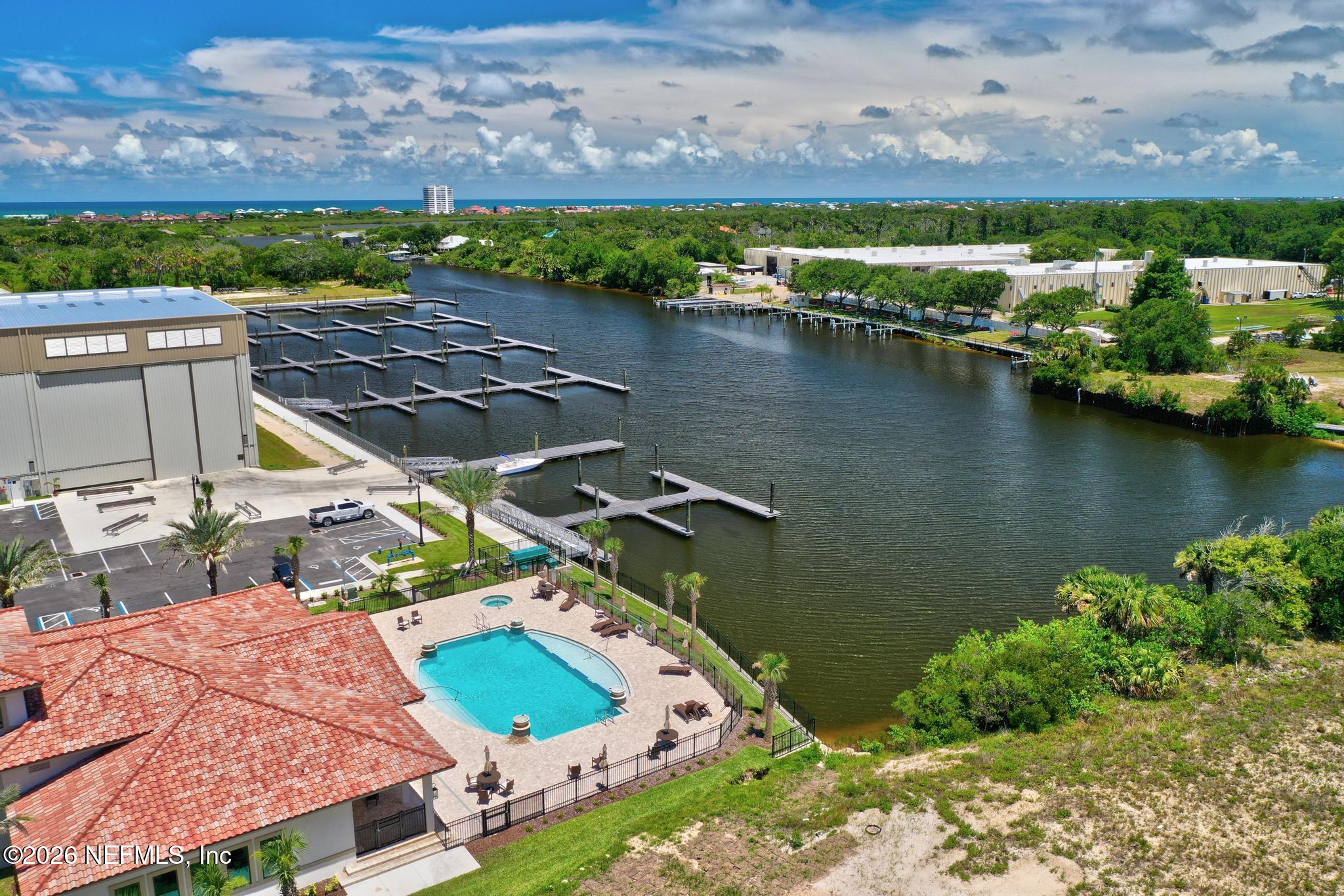 2 Menorca Way Palm Coast, FL 32137 - Photo 14 of 37 an aerial view of a house with a lake view