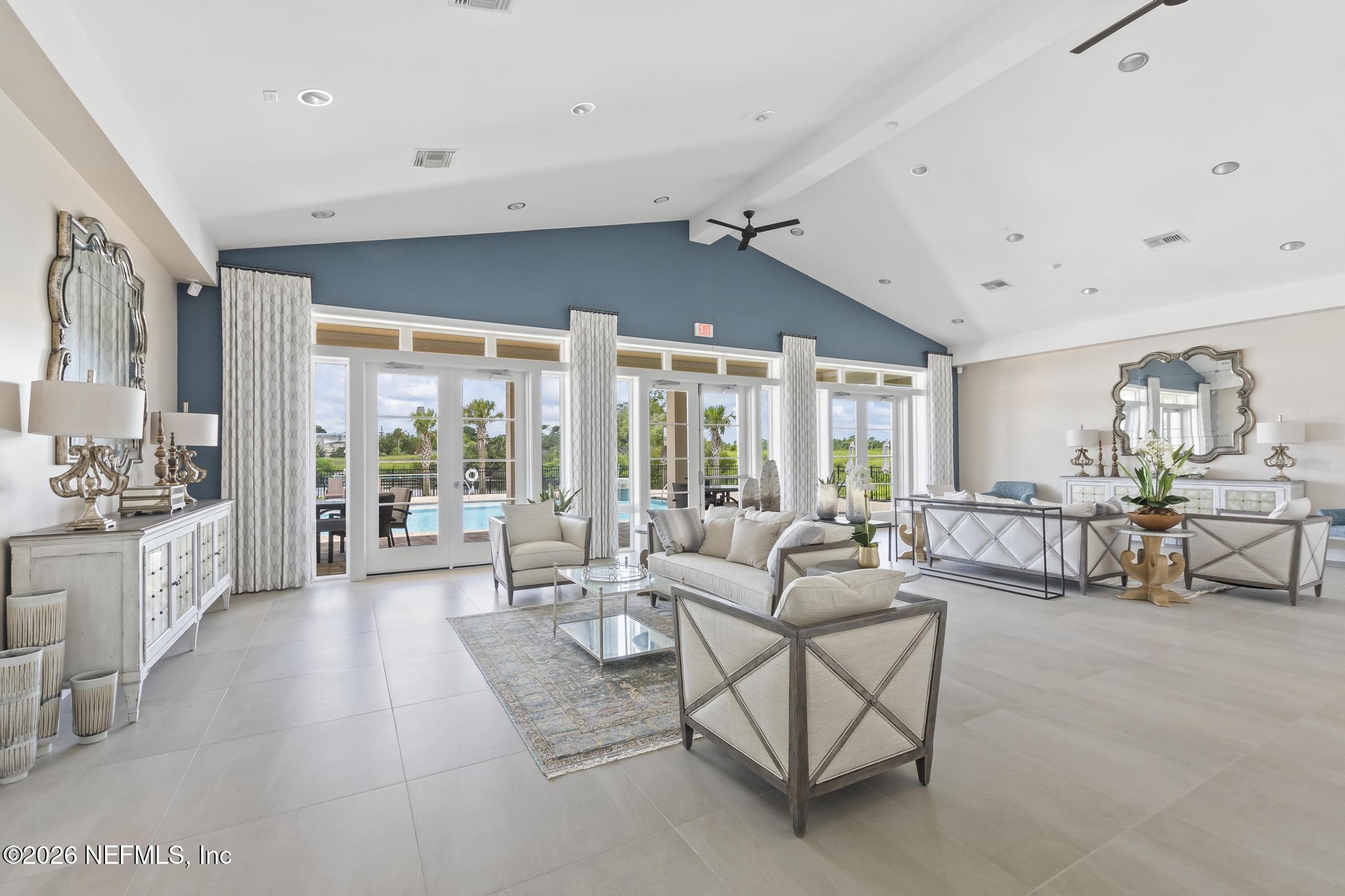 2 Menorca Way Palm Coast, FL 32137 - Photo 18 of 37 a living room with furniture and a large window