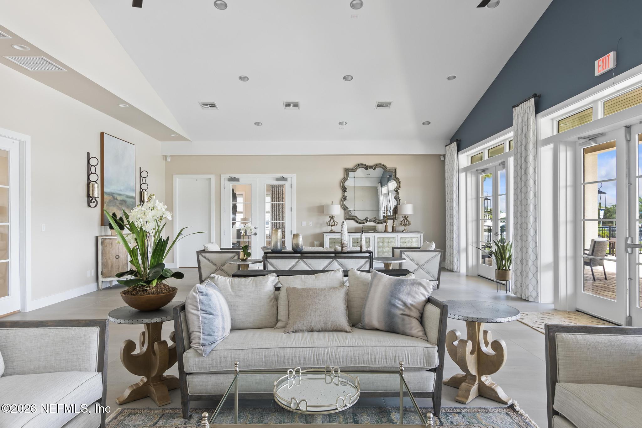 2 Menorca Way Palm Coast, FL 32137 - Photo 20 of 37 a living room with furniture potted plant and a large window