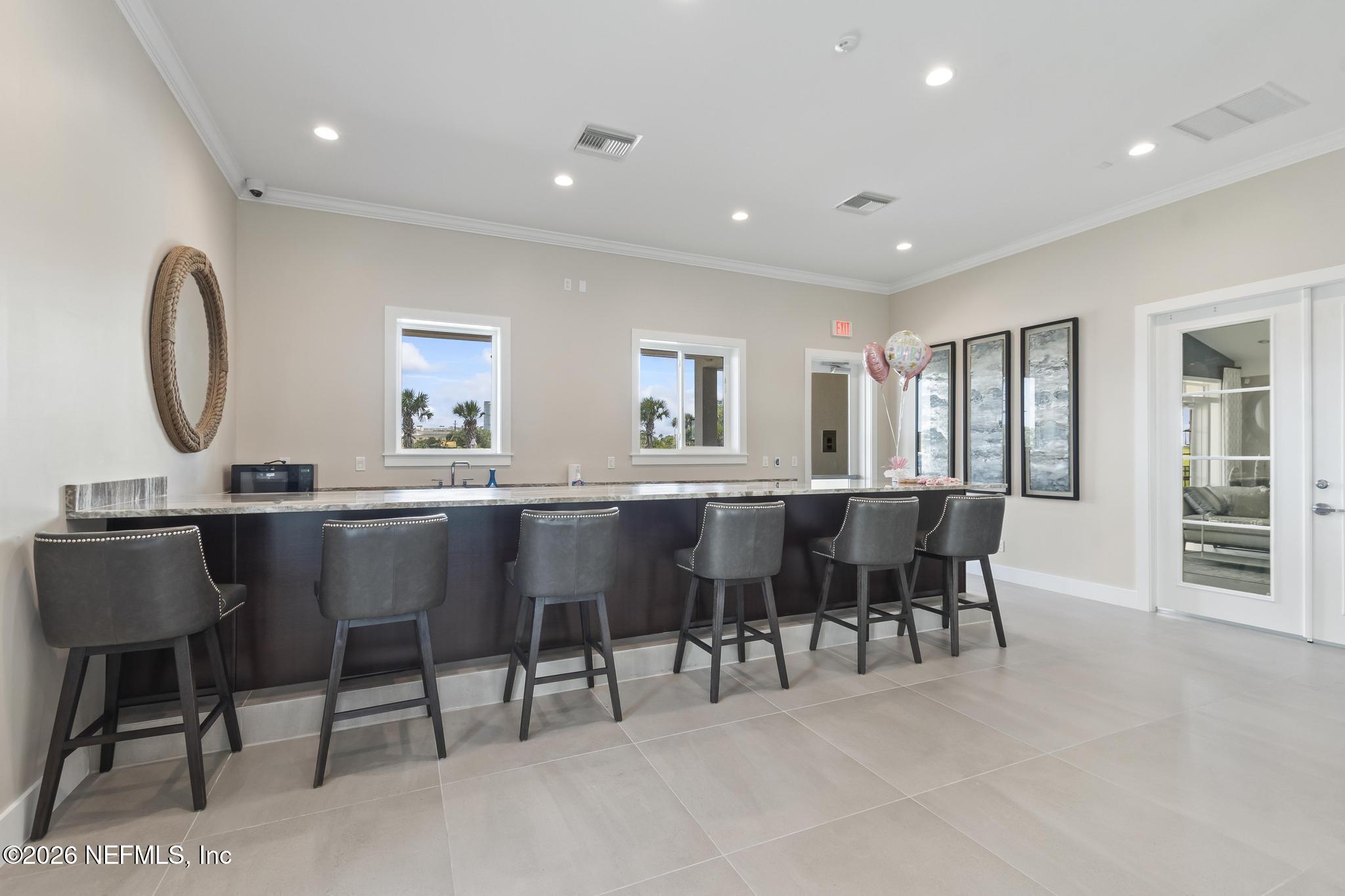 2 Menorca Way Palm Coast, FL 32137 - Photo 28 of 37 a living room with furniture a dining table and a window