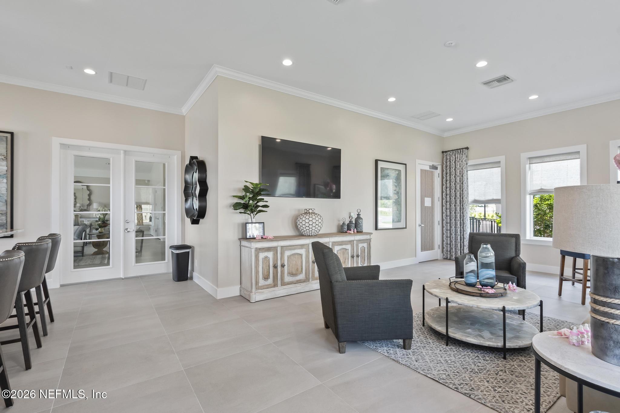 2 Menorca Way Palm Coast, FL 32137 - Photo 29 of 37 a living room with furniture and a flat screen tv