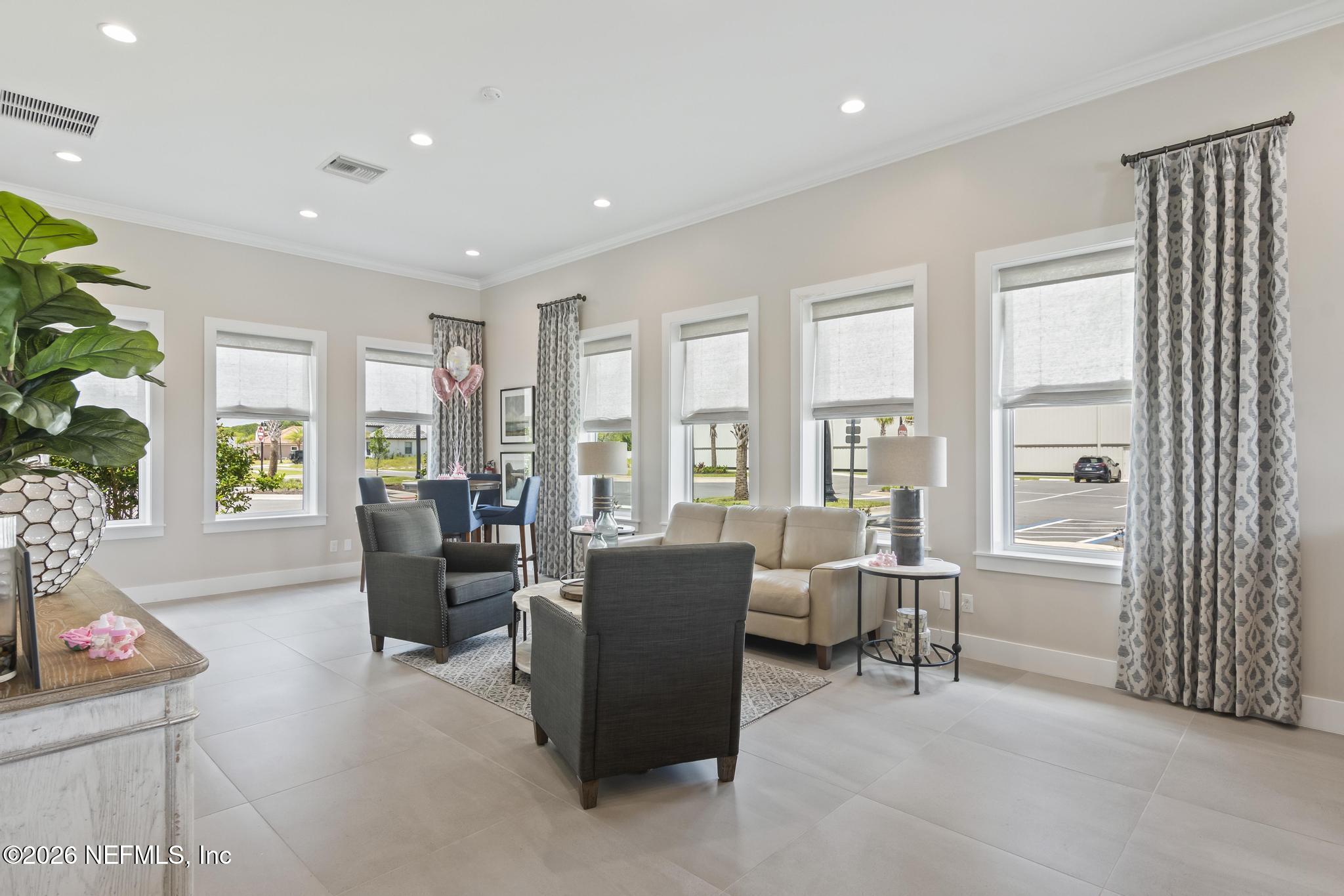 2 Menorca Way Palm Coast, FL 32137 - Photo 30 of 37 a living room with furniture and large windows