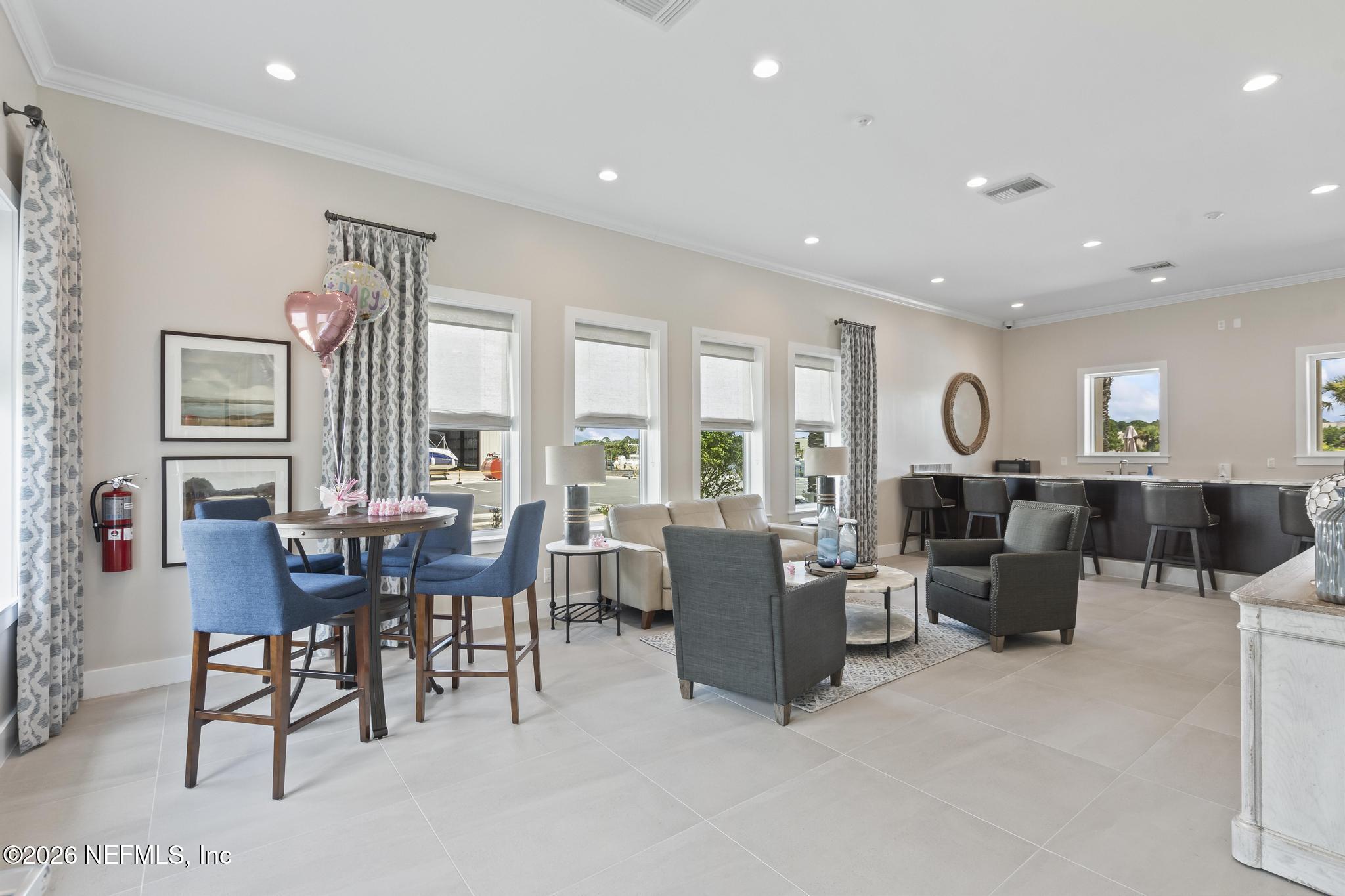 2 Menorca Way Palm Coast, FL 32137 - Photo 32 of 37 a living room with furniture and a large window