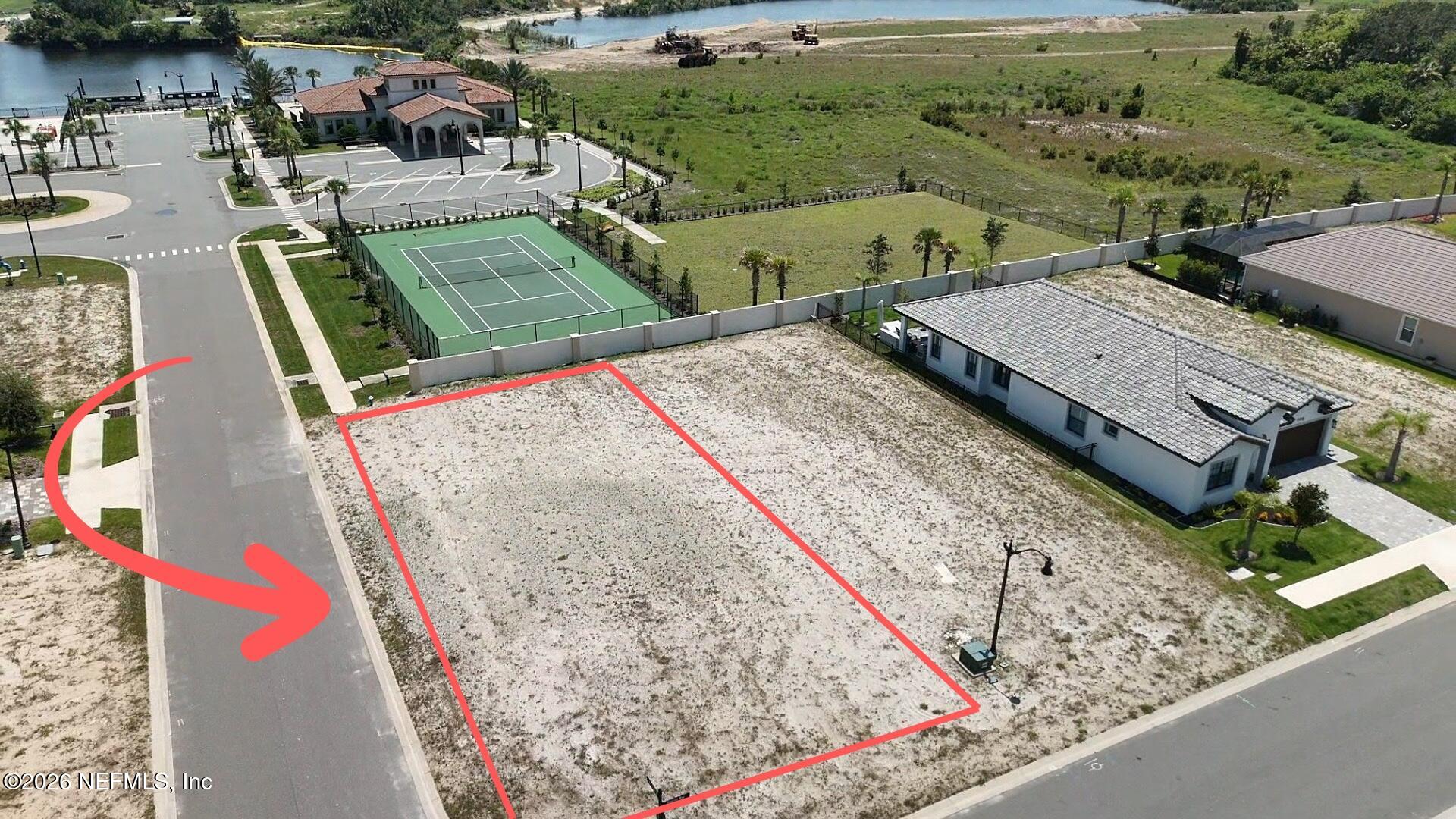2 Menorca Way Palm Coast, FL 32137 - Photo 4 of 37 an aerial view of a house with a yard and lake view
