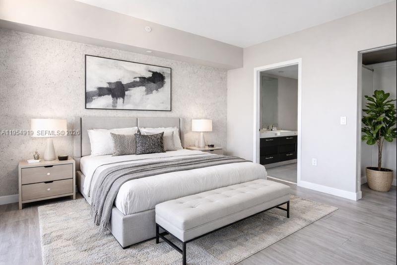 45 Southwest 9th Street, Unit 1208 Miami, FL 33130 - Photo 11 of 27 a bedroom with a bed and a potted plant