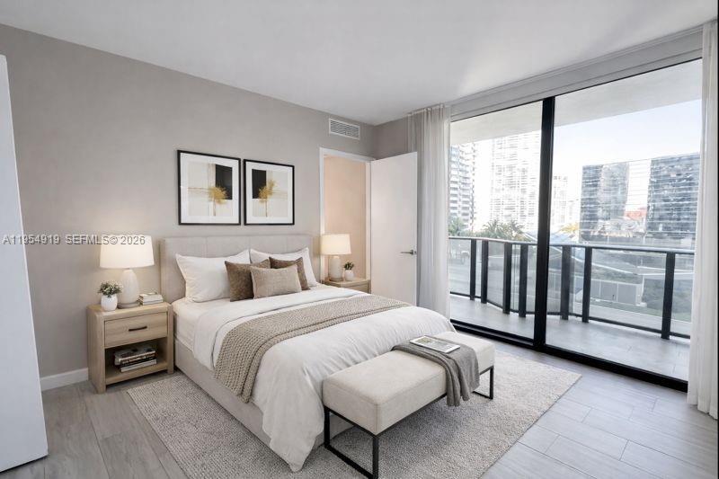 45 Southwest 9th Street, Unit 1208 Miami, FL 33130 - Photo 15 of 27 a bedroom with a bed and a large window