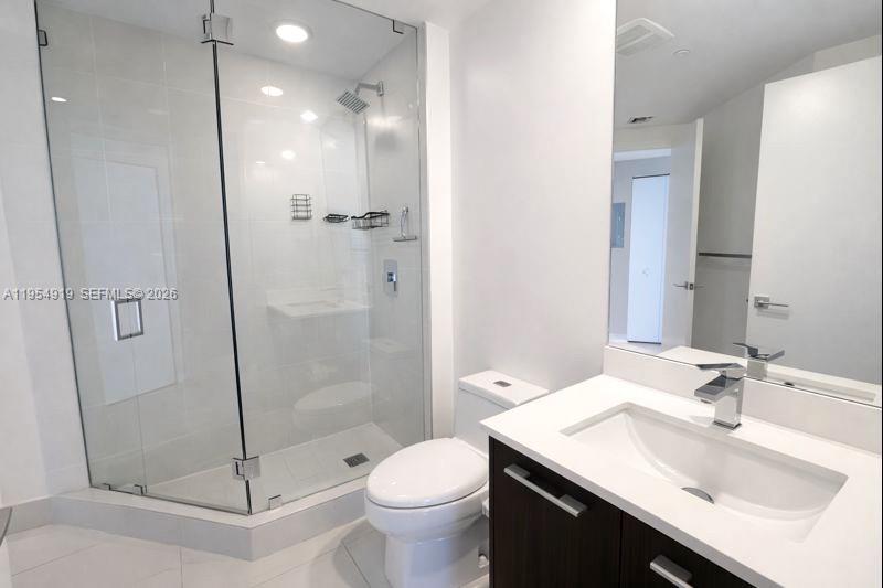45 Southwest 9th Street, Unit 1208 Miami, FL 33130 - Photo 17 of 27 a bathroom with a sink toilet and shower