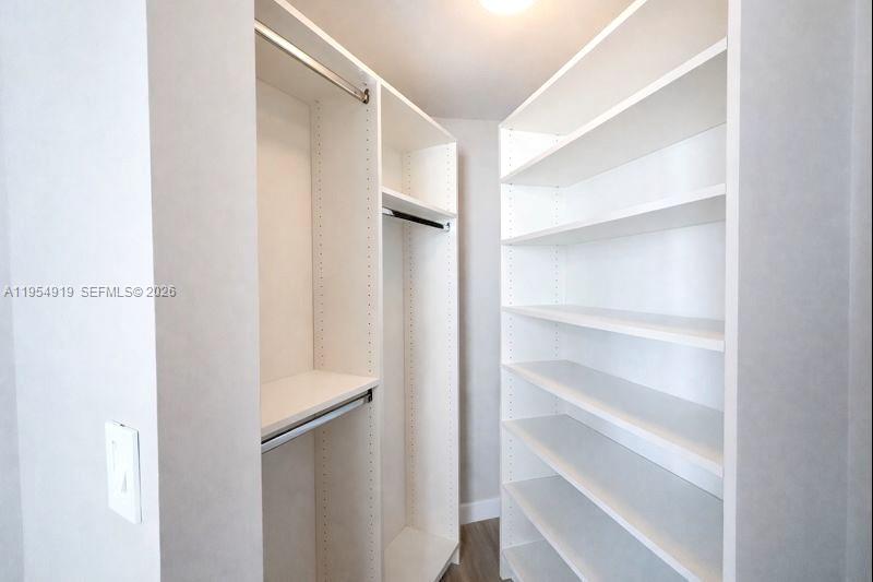 45 Southwest 9th Street, Unit 1208 Miami, FL 33130 - Photo 22 of 27 a view of walk in closet with empty racks
