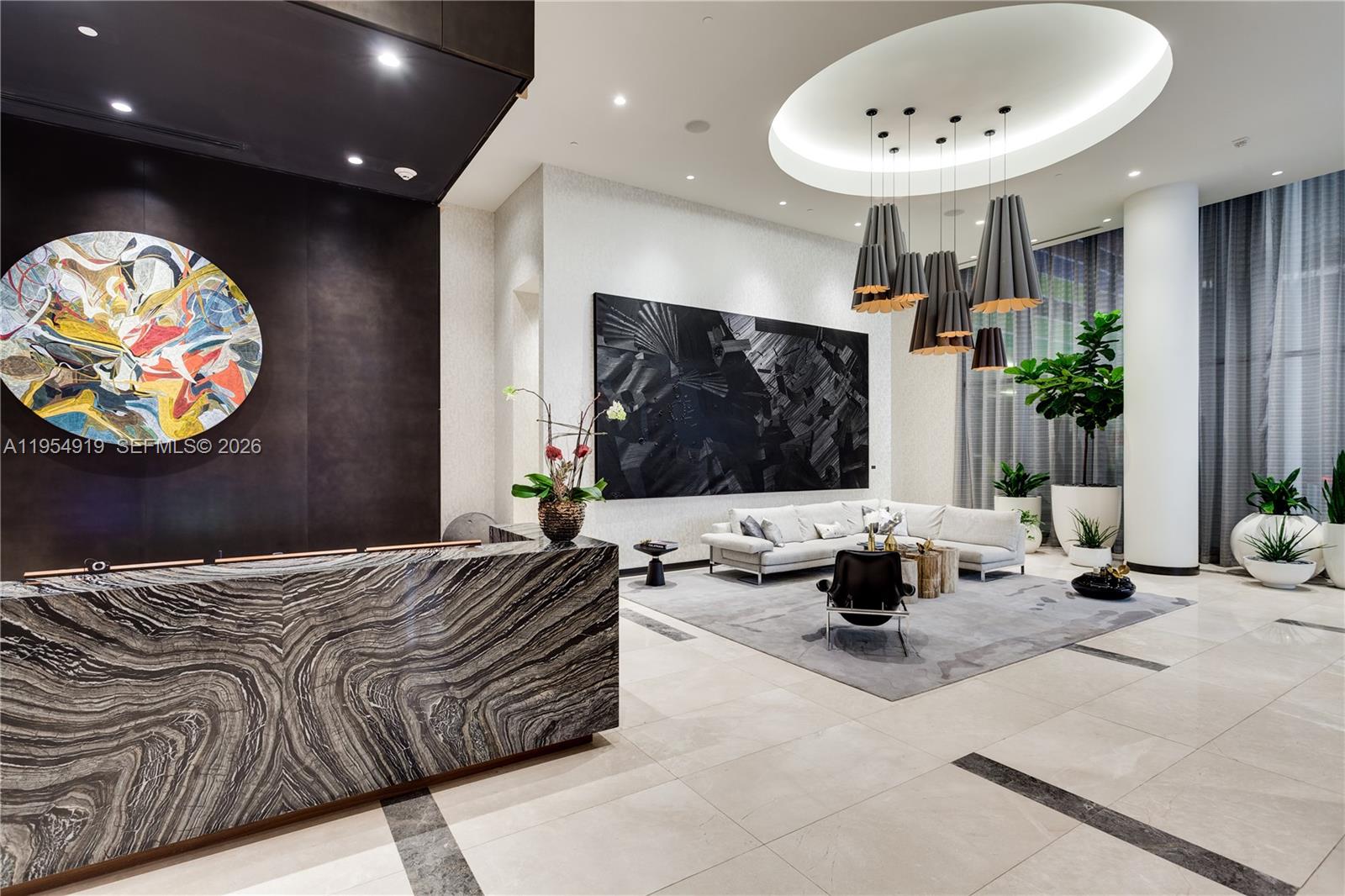 45 Southwest 9th Street, Unit 1208 Miami, FL 33130 - Photo 28 of 40 a living room with furniture and a flat screen tv