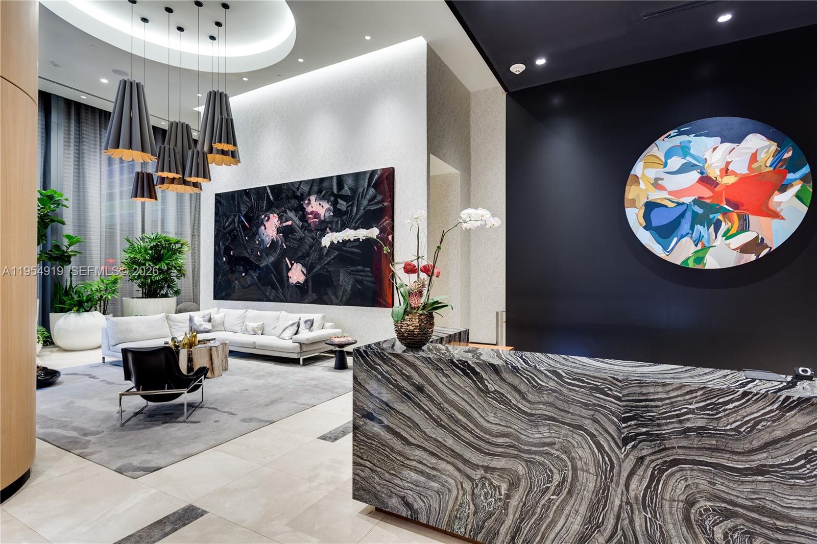 45 Southwest 9th Street, Unit 1208 Miami, FL 33130 - Photo 29 of 40 a bedroom with a bed and a wall painting