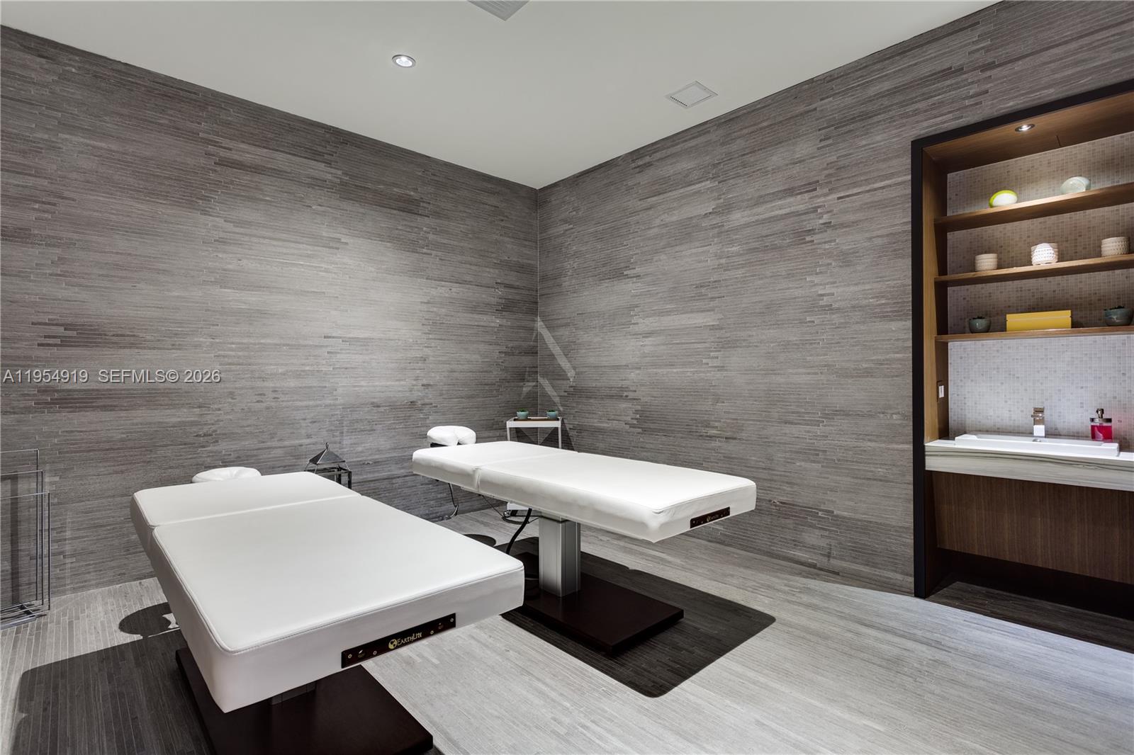 45 Southwest 9th Street, Unit 1208 Miami, FL 33130 - Photo 33 of 40 a bathroom with a toilet a sink and mirror