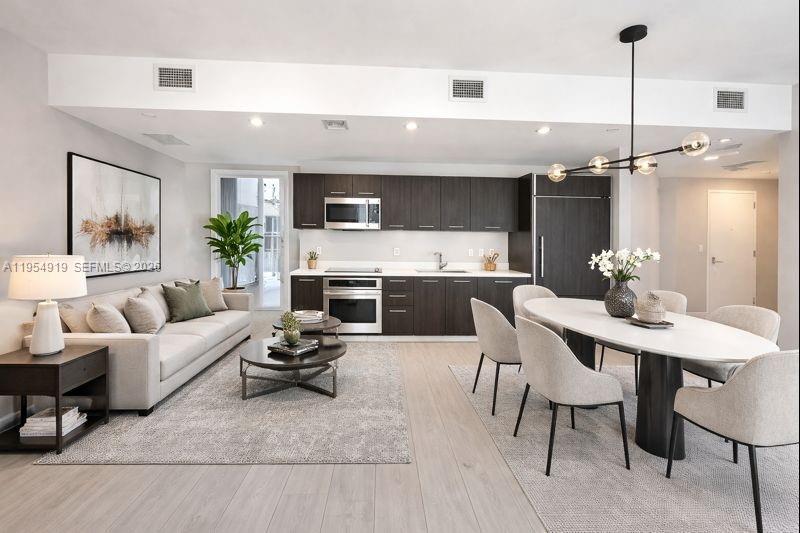 45 Southwest 9th Street, Unit 1208 Miami, FL 33130 - Photo 6 of 27 a living room with furniture and a table