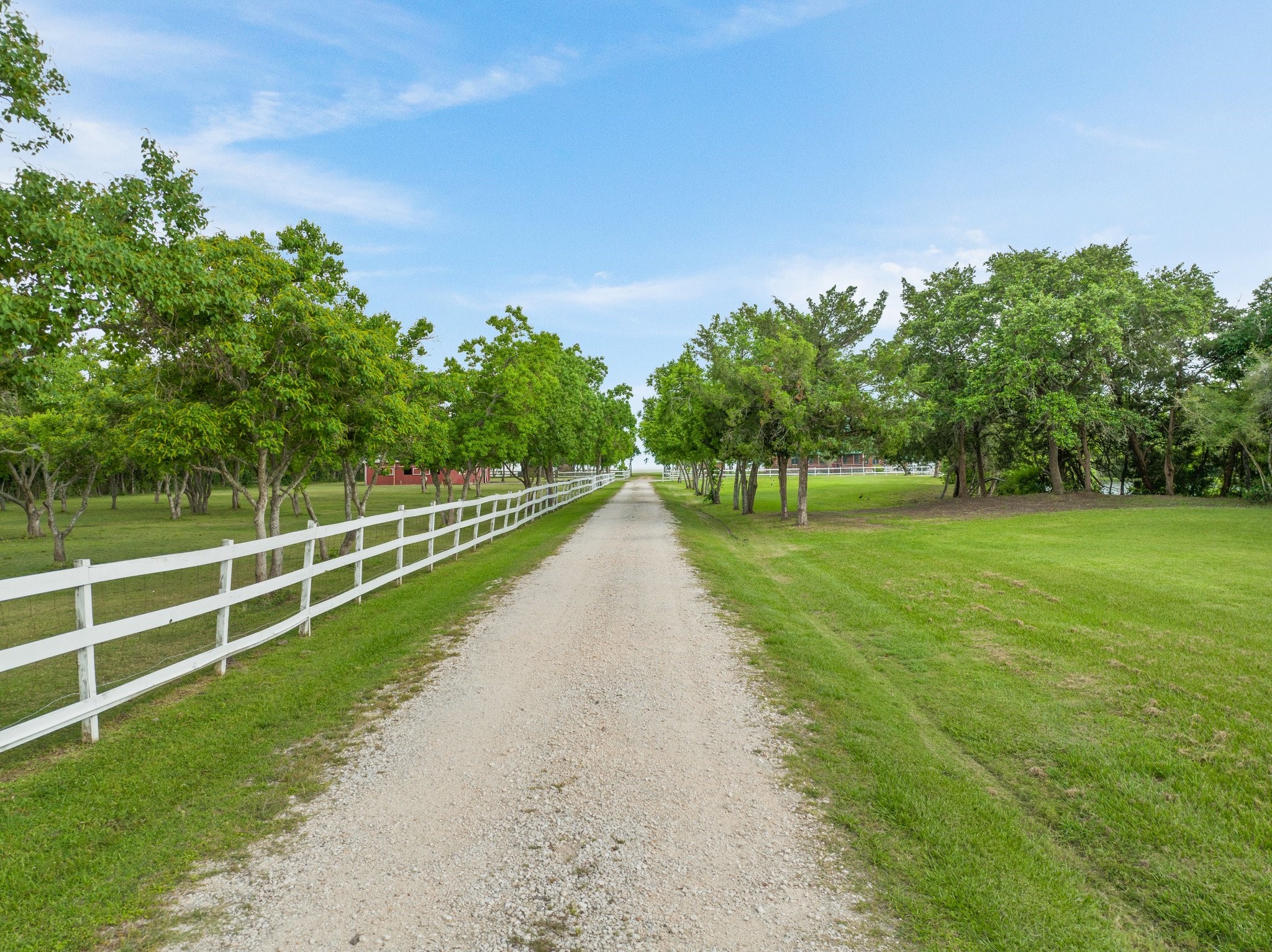 8226 Fm 2354 Beach Baytown, TX 77523 - Photo 2 of 39 The main home is set back over 900 feet from the road for ultimate privacy and seclusion. An electric keypad access gate welcomes you to the property’s private drive.