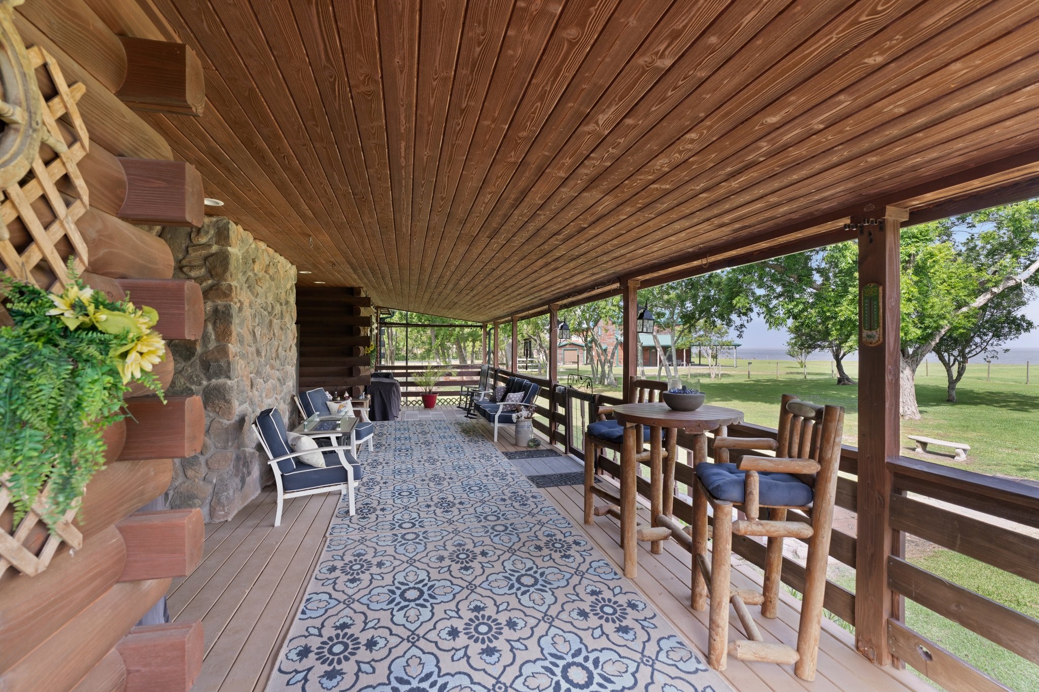 8226 Fm 2354 Beach Baytown, TX 77523 - Photo 24 of 39 Unwind on the covered back porch, where gentle breezes and views of the water create the perfect setting for morning coffee or evening wine.