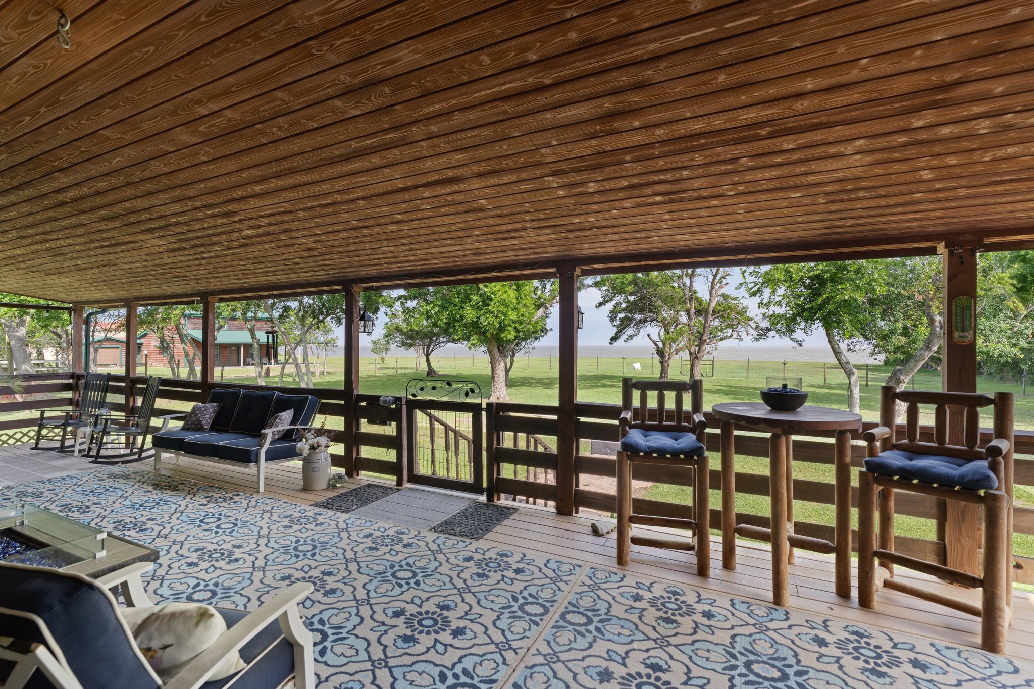 8226 Fm 2354 Beach Baytown, TX 77523 - Photo 25 of 39 Perfect for gatherings large or small, the covered porches and patios create outdoor living spaces that feel as comfortable as the interiors.