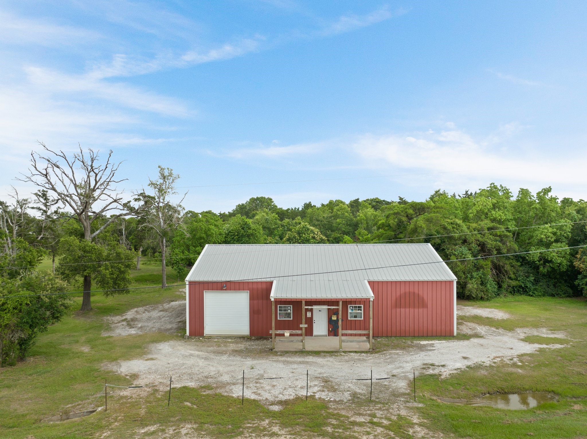 8226 Fm 2354 Beach Baytown, TX 77523 - Photo 37 of 39 This sturdy multi-purpose structure once served the area as a feed store and is now ready for its next chapter. With electricity, water, and FM Road frontage, this commercial-grade outbuilding is a rare rural amenity.