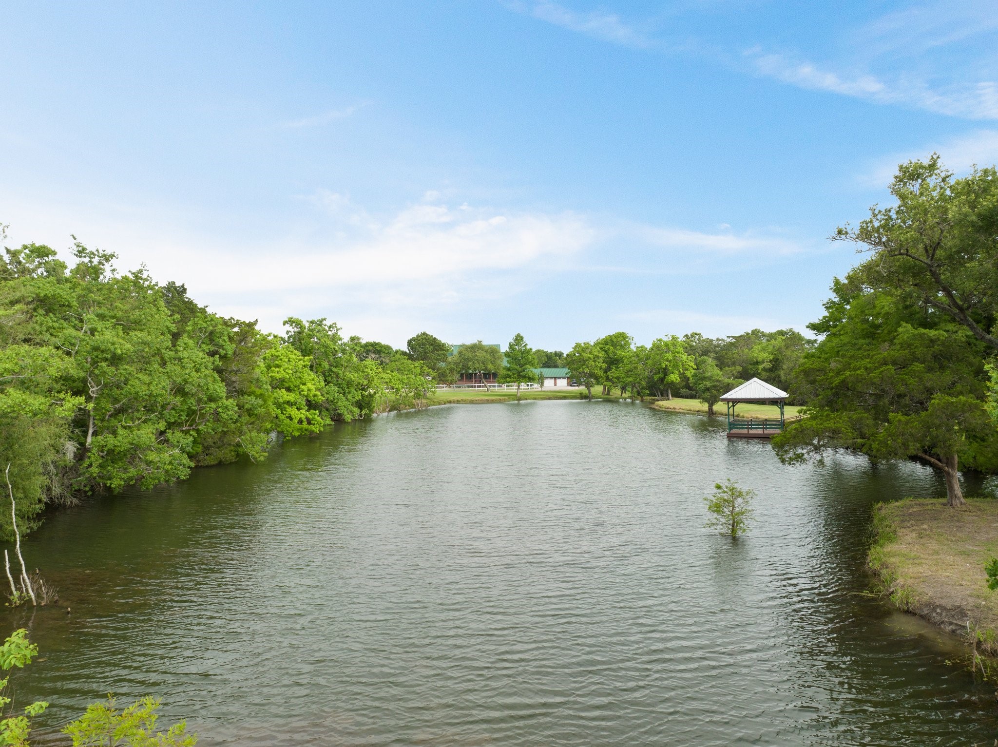 8226 Fm 2354 Beach Baytown, TX 77523 - Photo 5 of 39 Imagine weekend mornings fishing at your own private freshwater pond, then gathering for a cookout on the covered patio—this property invites lasting memories.