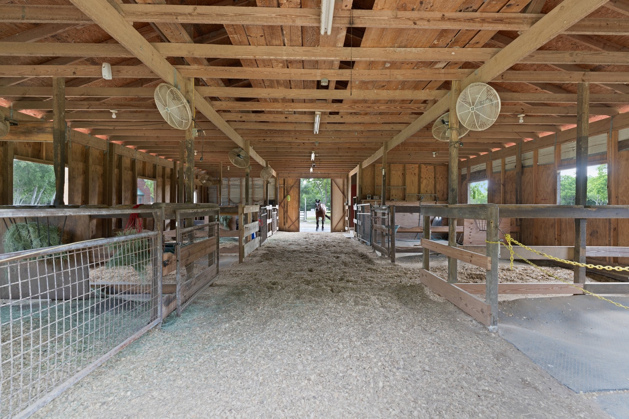 8226 Fm 2354 Beach Baytown, TX 77523 - Photo 10 of 39 The custom 36'x48' barn includes seven 12'x12' stalls, each with fans and built-in radios as well as a dedicated 12'x12' tack/feed room.