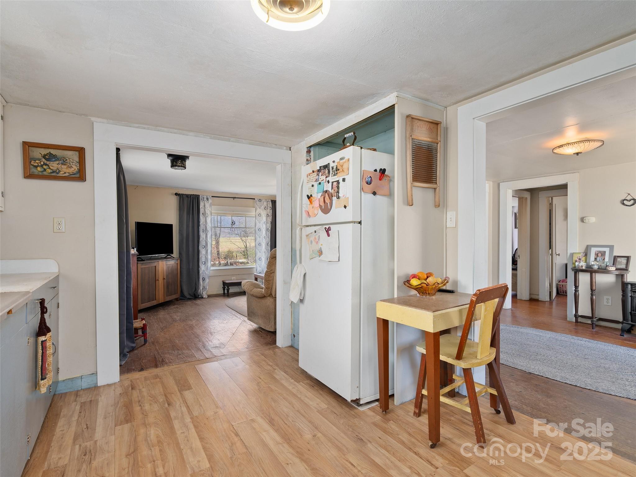 396 Will Hyatt Road Waynesville, NC 28786 - Photo 11 of 23 a view of a livingroom with furniture and wooden floor
