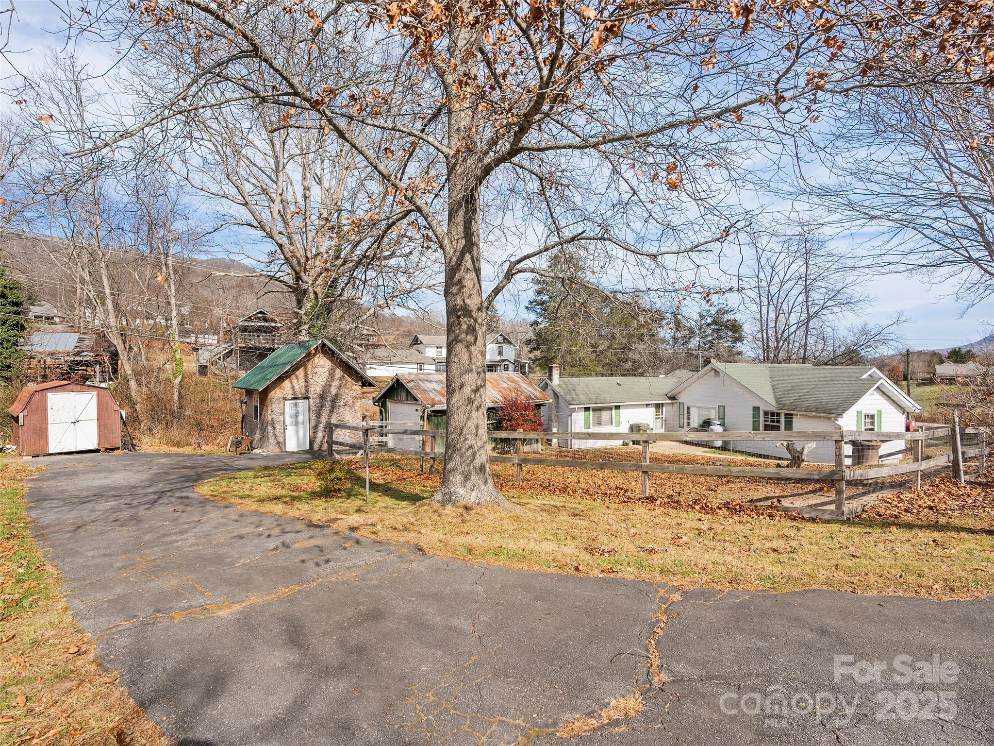 396 Will Hyatt Road Waynesville, NC 28786 - Photo 16 of 23 a view of a yard covered with snow