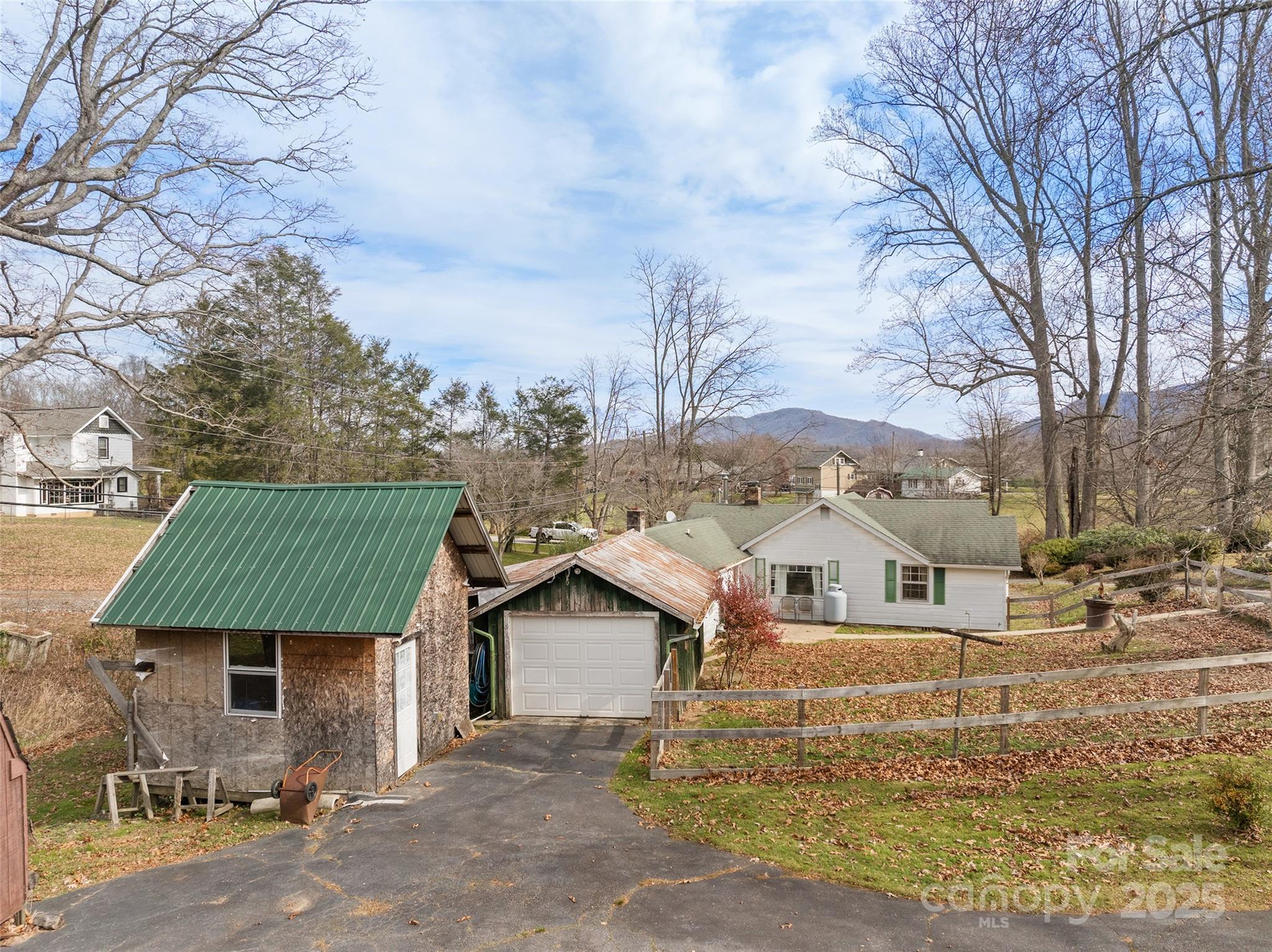 396 Will Hyatt Road Waynesville, NC 28786 - Photo 17 of 23 a house view with a garden space