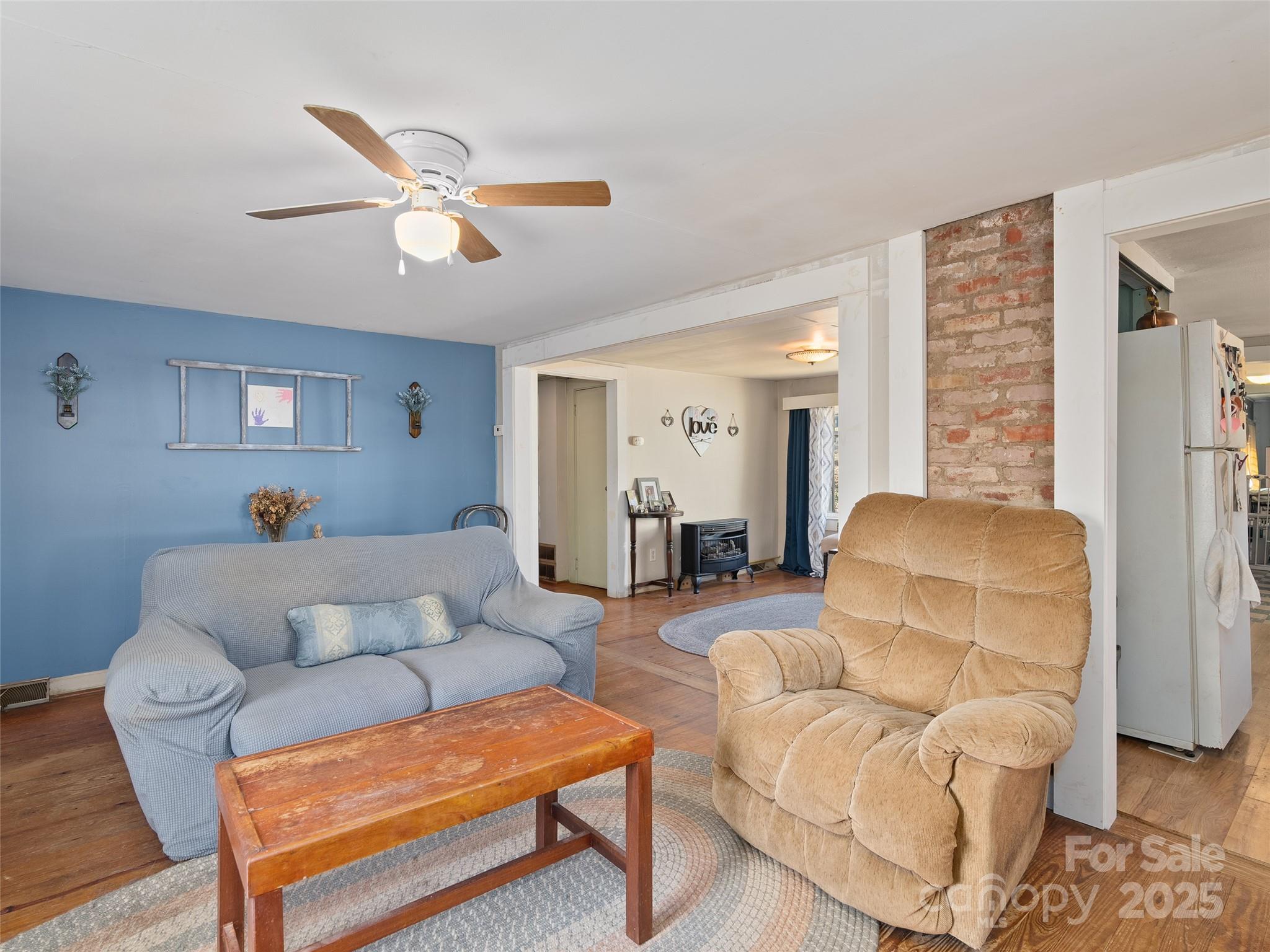 396 Will Hyatt Road Waynesville, NC 28786 - Photo 5 of 23 a living room with furniture and a wooden floor