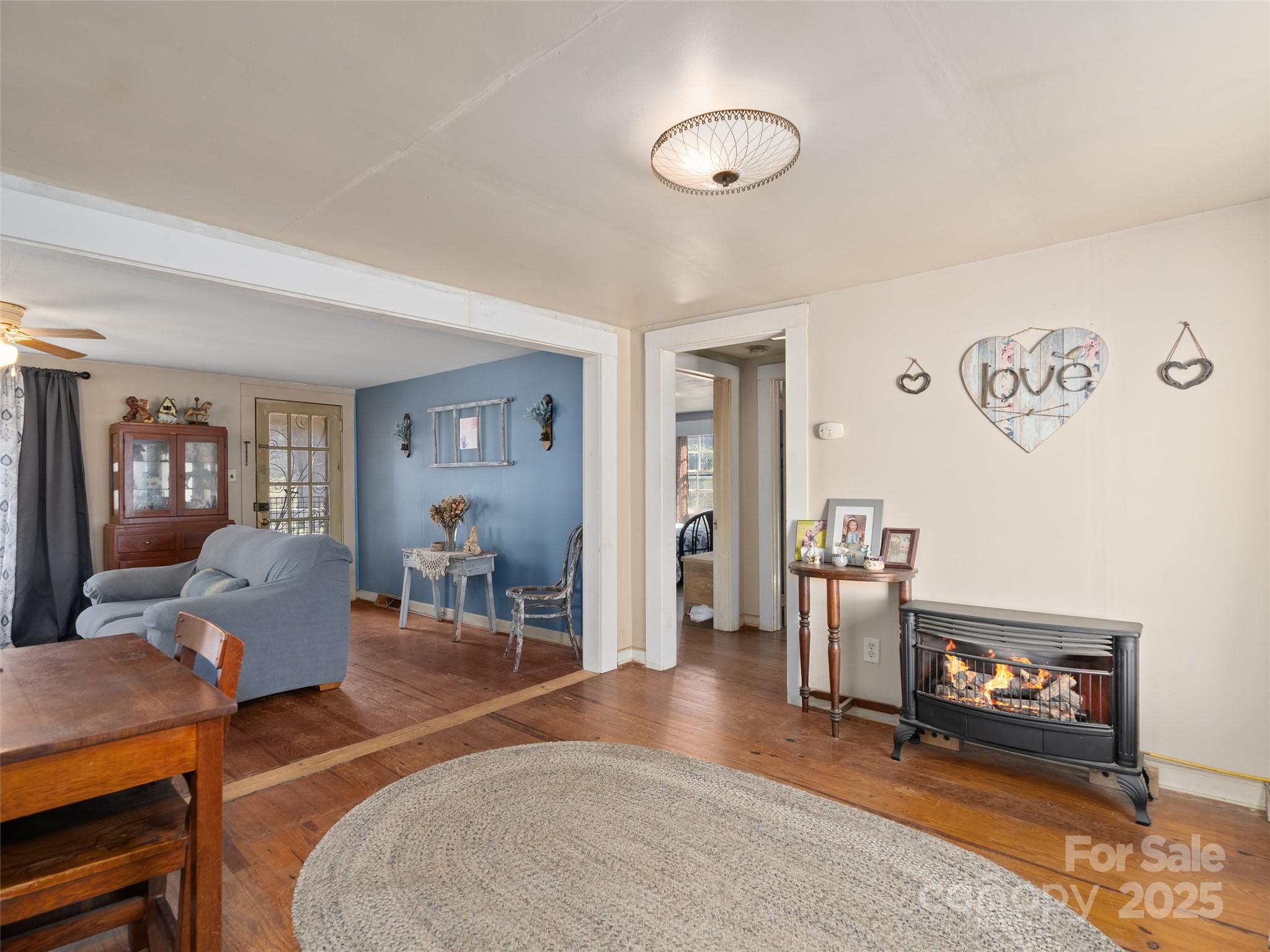 396 Will Hyatt Road Waynesville, NC 28786 - Photo 6 of 23 a living room with furniture and a wooden floor