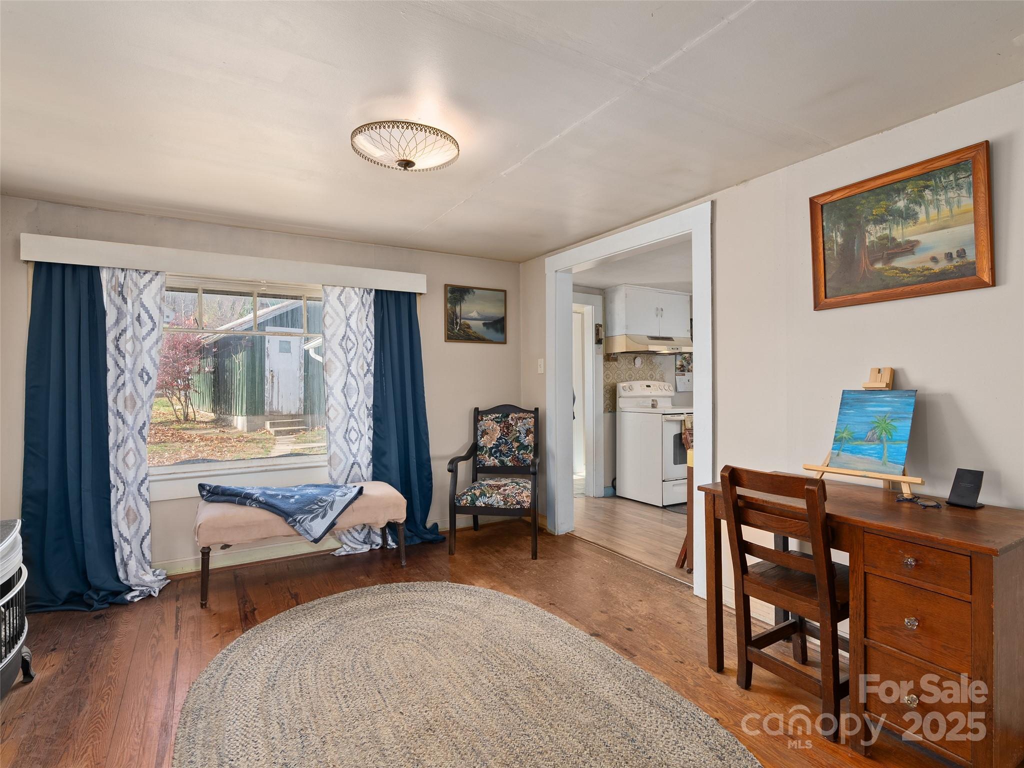 396 Will Hyatt Road Waynesville, NC 28786 - Photo 7 of 23 a bedroom with furniture and a window
