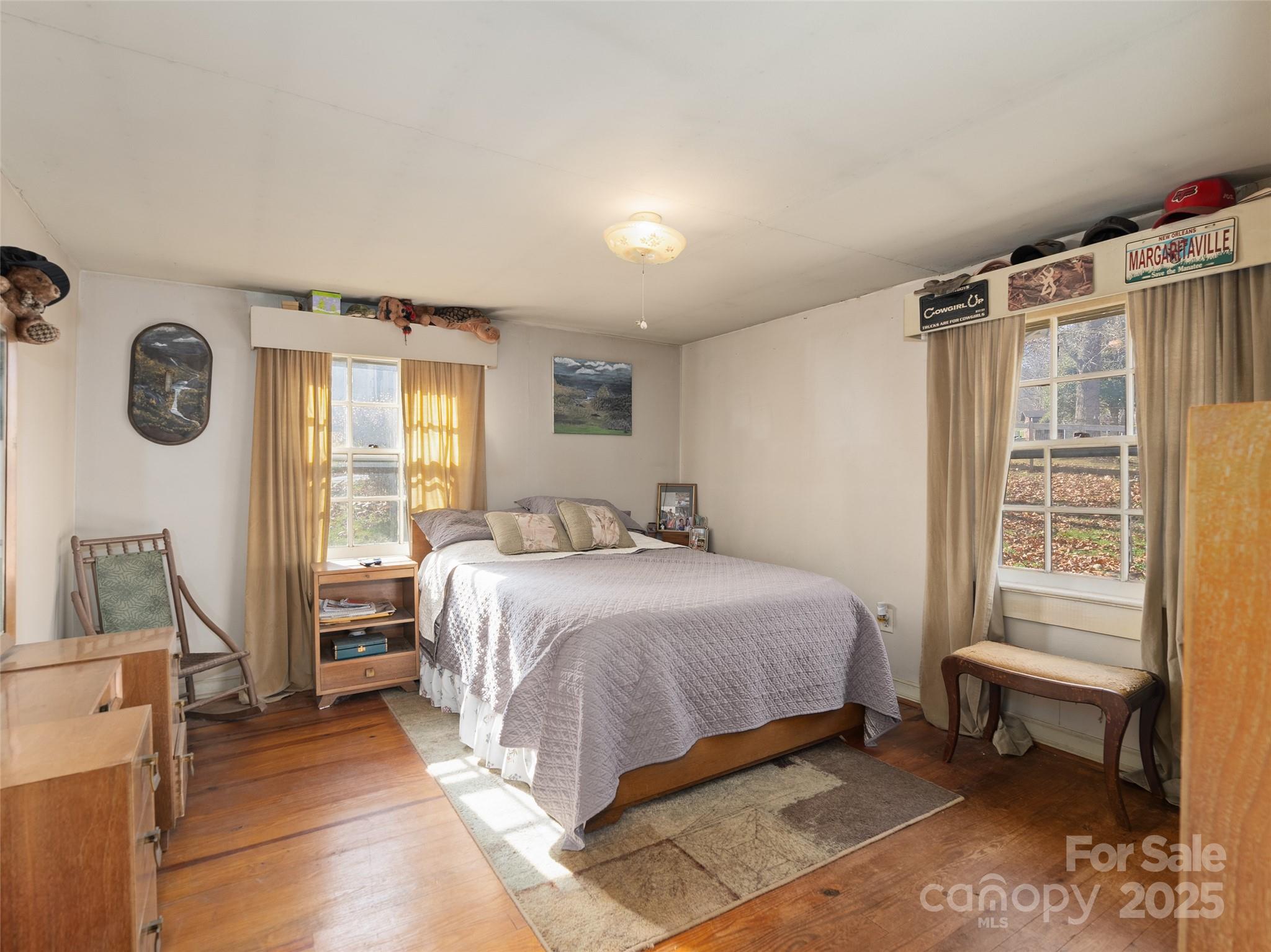396 Will Hyatt Road Waynesville, NC 28786 - Photo 9 of 23 a bedroom with a bed and a window