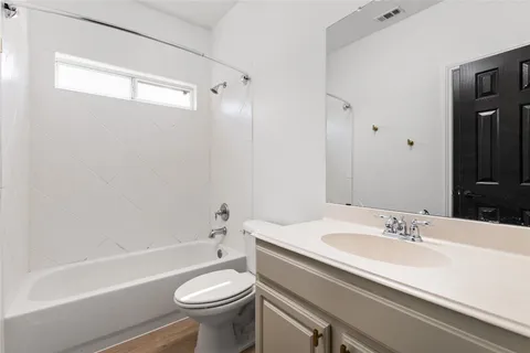 a bathroom with a sink a toilet and a bathtub