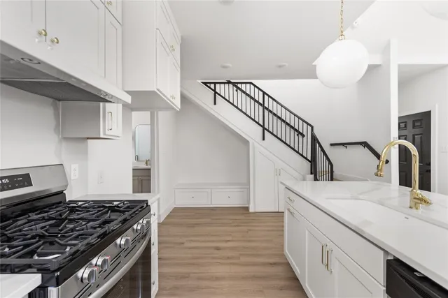 a kitchen with a stove and a sink