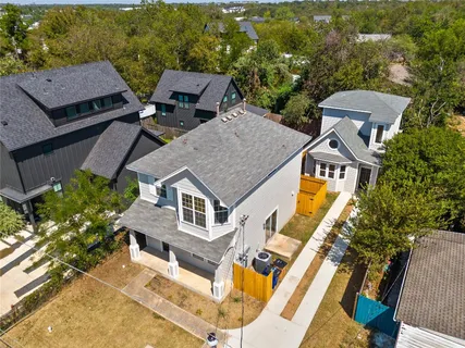 an aerial view of a house with a garden