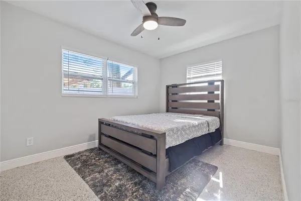 a bedroom with a bed and window