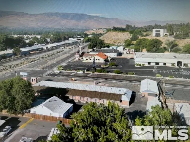 an aerial view of residential houses and outdoor space