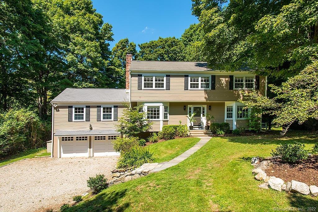 3 Raphael Way Westport, CT 06880 - Photo 1 of 1 a front view of a house with a yard table and chairs