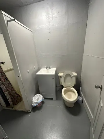 a bathroom with a toilet and a sink