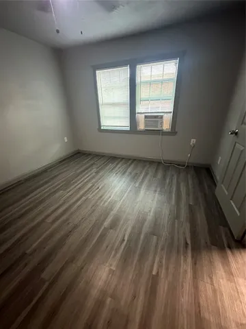 a kitchen with a sink a stove and cabinets