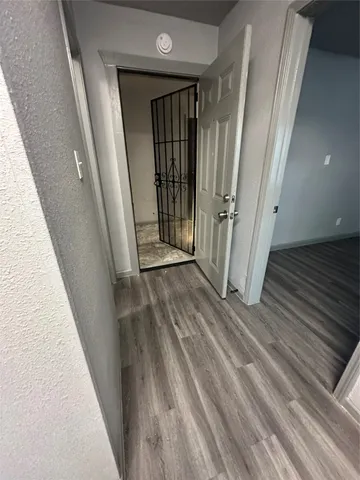 a kitchen with stainless steel appliances a stove and white cabinets