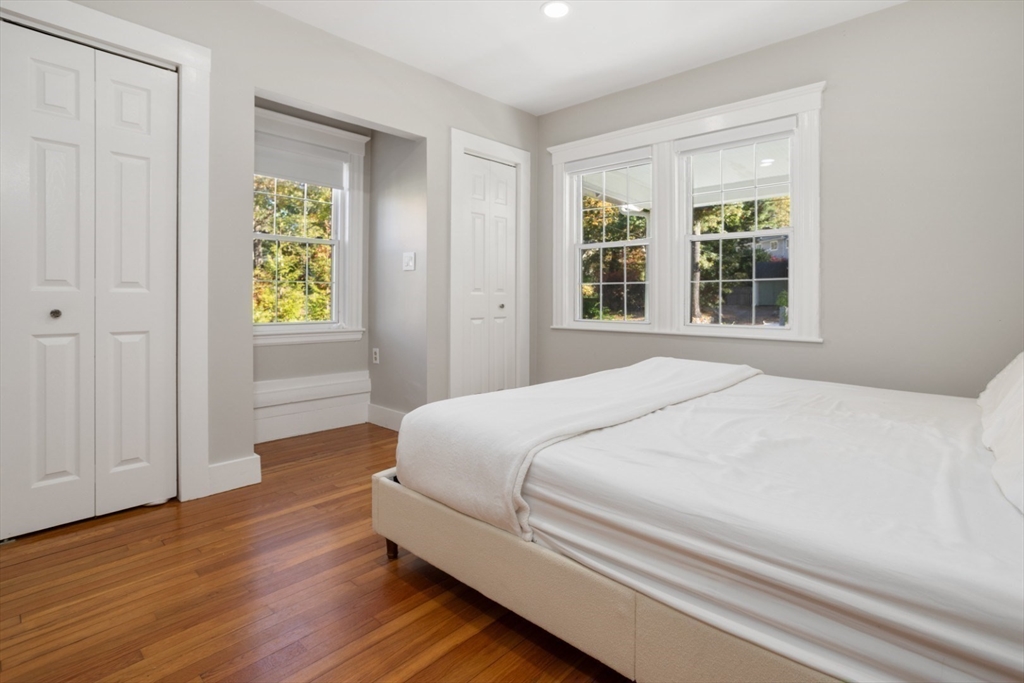 928 Main Street Lynnfield, MA 01940 - Photo 16 of 41 a bedroom with a bed and a window
