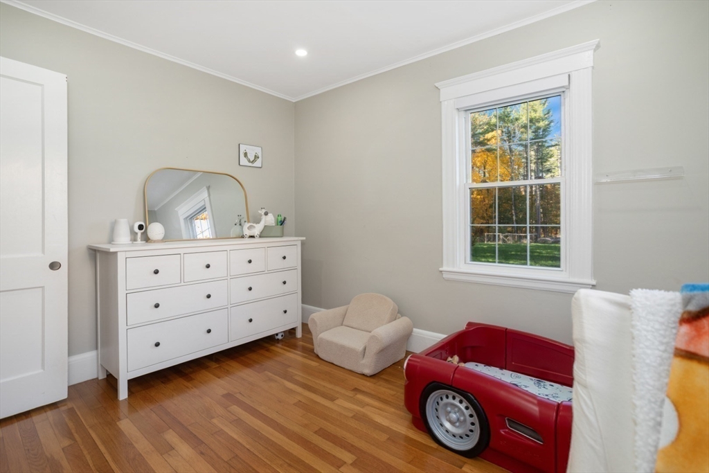 928 Main Street Lynnfield, MA 01940 - Photo 18 of 41 a bedroom with a bed and a window