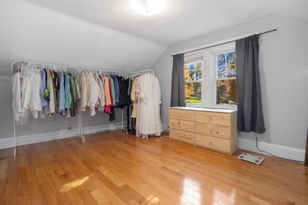 928 Main Street Lynnfield, MA 01940 - Photo 23 of 41 a view of walk in closet with clothes and shoes