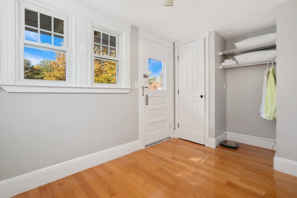928 Main Street Lynnfield, MA 01940 - Photo 27 of 41 a view of an empty room with wooden floor and windows