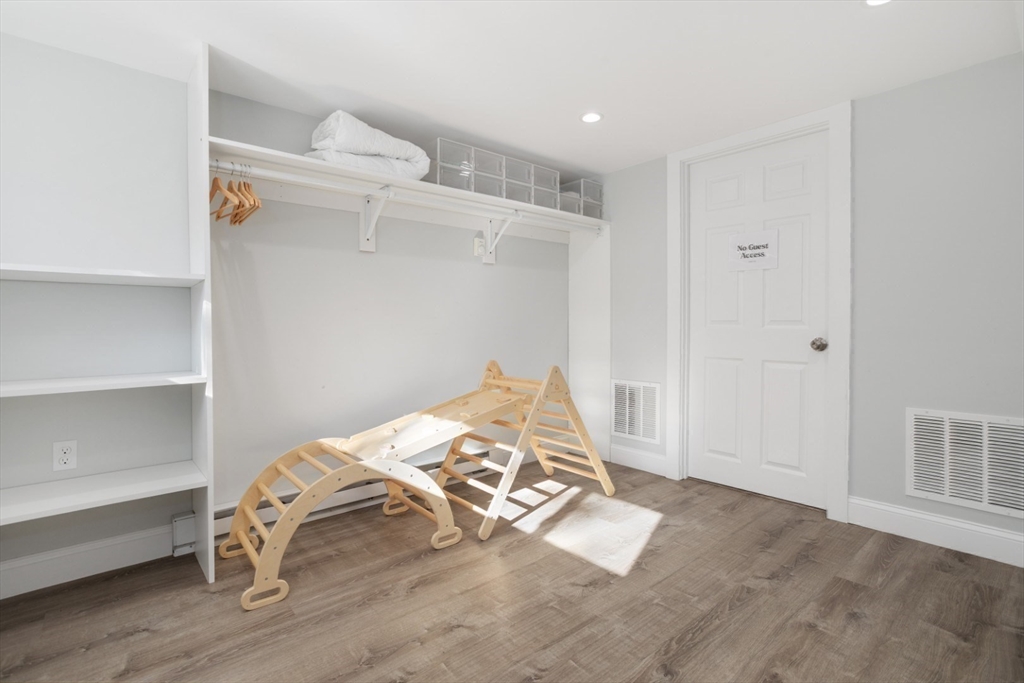 928 Main Street Lynnfield, MA 01940 - Photo 28 of 41 a bedroom with a bed and a window