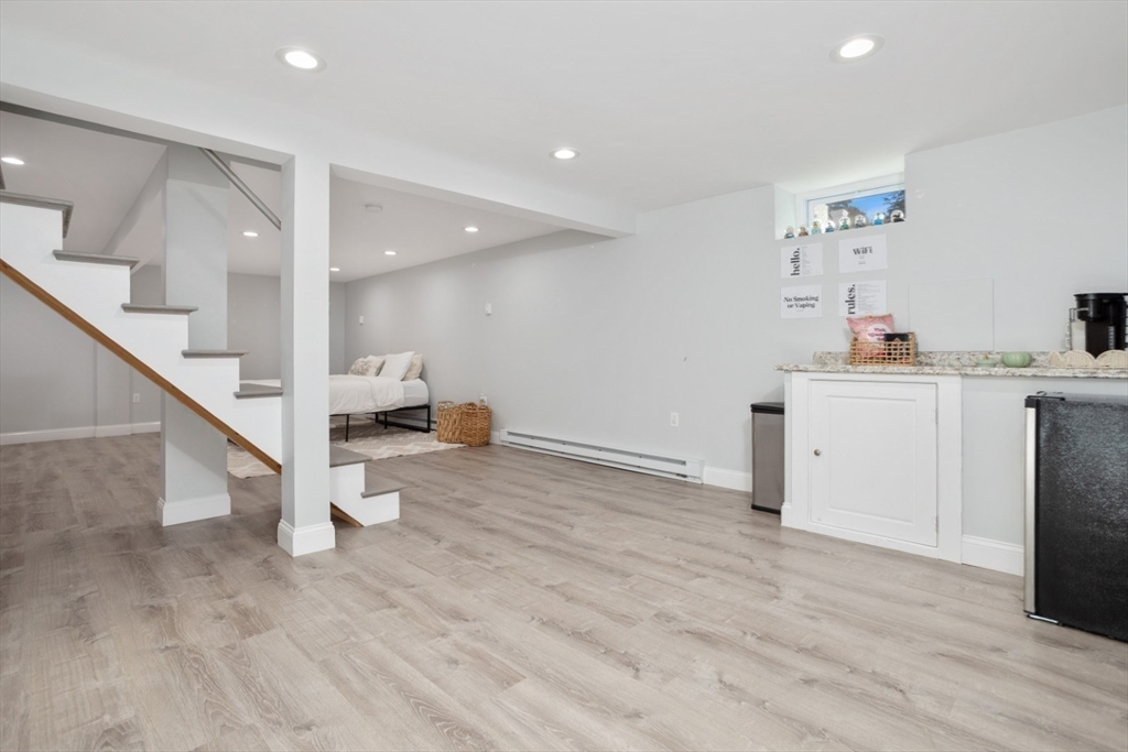 928 Main Street Lynnfield, MA 01940 - Photo 29 of 41 a view of a kitchen with wooden floor and staircase