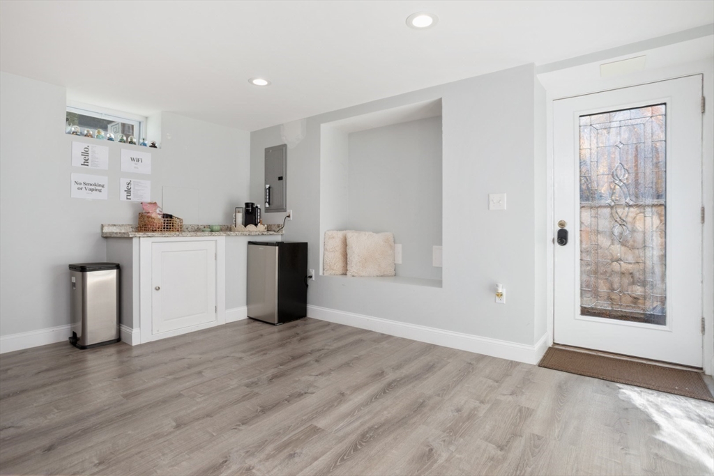 928 Main Street Lynnfield, MA 01940 - Photo 30 of 41 a view of a kitchen with an empty room and wooden floor