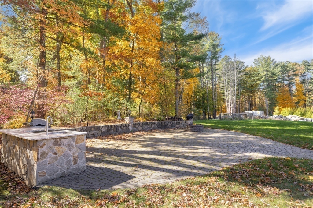 928 Main Street Lynnfield, MA 01940 - Photo 3 of 41 a view of a yard with plants and trees