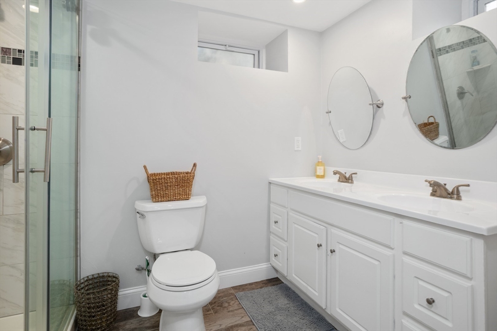 928 Main Street Lynnfield, MA 01940 - Photo 34 of 41 a bathroom with a toilet sink and mirror